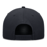 Human Made KAWS x Nike Yankees navy snapback cap with structured A-frame design and Yankees logo on front.