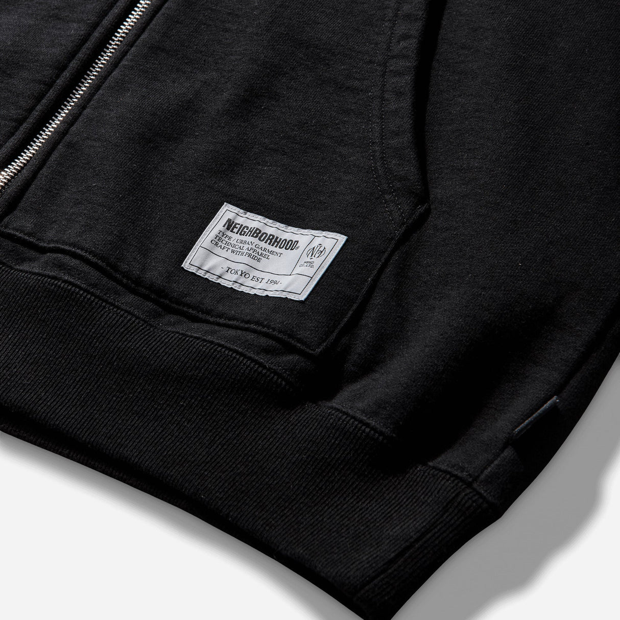 Black NEIGHBORHOOD Classic Zip Hoodie, front view showing zip closure and hood, made from comfortable sweatshirt fabric.