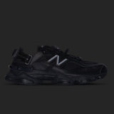 Black New Balance 9060 Mule sneakers featuring a sleek, minimalist design and comfortable fit.