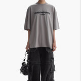 Gray MasonPrince Classic Spray Logo T-shirt displayed on a mannequin, showcasing the relaxed fit and graphic design.