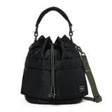 Black Porter Yoshida Japan Tanker 2-Way Tool Bag with multiple compartments, durable fabric, and adjustable straps.