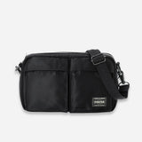 Black Porter Yoshida Japan Tanker Sling Bag featuring adjustable strap and compact design, perfect for everyday carrying.