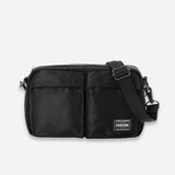 Black Porter Yoshida Japan Tanker Sling Bag with adjustable strap and sleek design, made from durable materials.