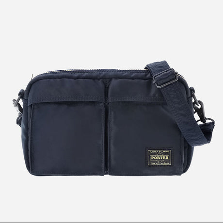 Navy Porter Yoshida Japan Tanker Shoulder Bag with adjustable strap and minimalist design, made of durable fabric.