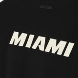 Fear of God Essentials X HEAT NBA 90s heavyweight black T-shirt, casual apparel with bold logo design and comfortable fit.
