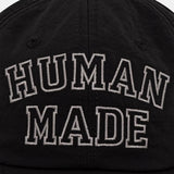 Black Human Made embroidered logo 6-panel cap, stylish headwear with detailed stitching and classic dad hat design.