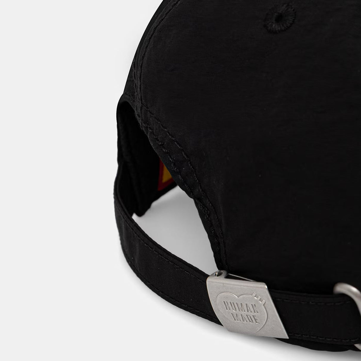 Black Human Made embroidered logo 6-panel cap, stylish headwear with detailed logo embroidery and adjustable strap.