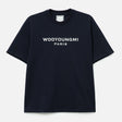 Dark navy Wooyoungmi front logo tee, casual apparel with a simple design and branded logo, displayed on a mannequin.