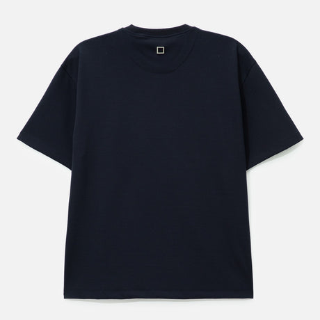 Dark navy Wooyoungmi front logo tee, casual apparel with bold branding, displayed on a hanger.