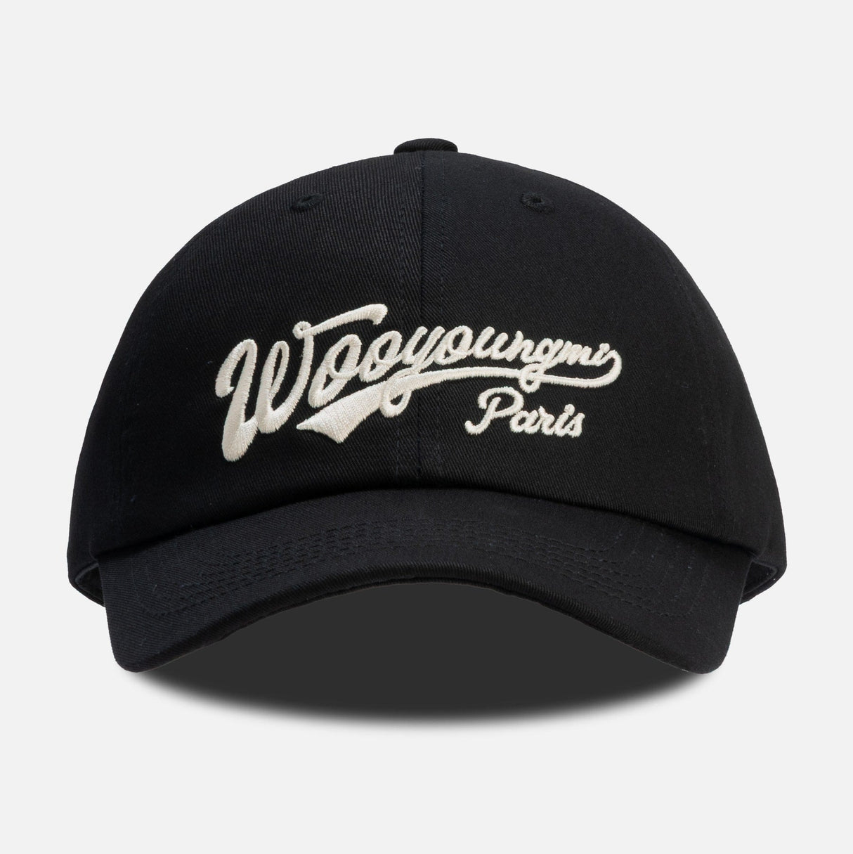 Black Wooyoungmi script logo cap, stylish headwear with adjustable strap and embroidered branding, perfect for casual wear.
