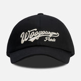 Black Wooyoungmi script logo cap, stylish headwear with adjustable strap and embroidered branding, perfect for casual wear.