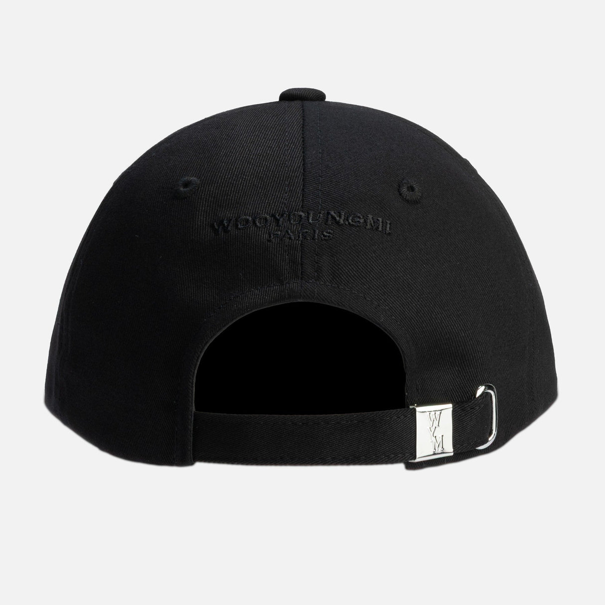 Black Wooyoungmi script logo cap, stylish headwear with adjustable strap, featuring the brand's signature logo on the front.