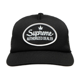 Black Supreme mesh trucker cap, a stylish headwear with breathable mesh panels and adjustable snapback closure.