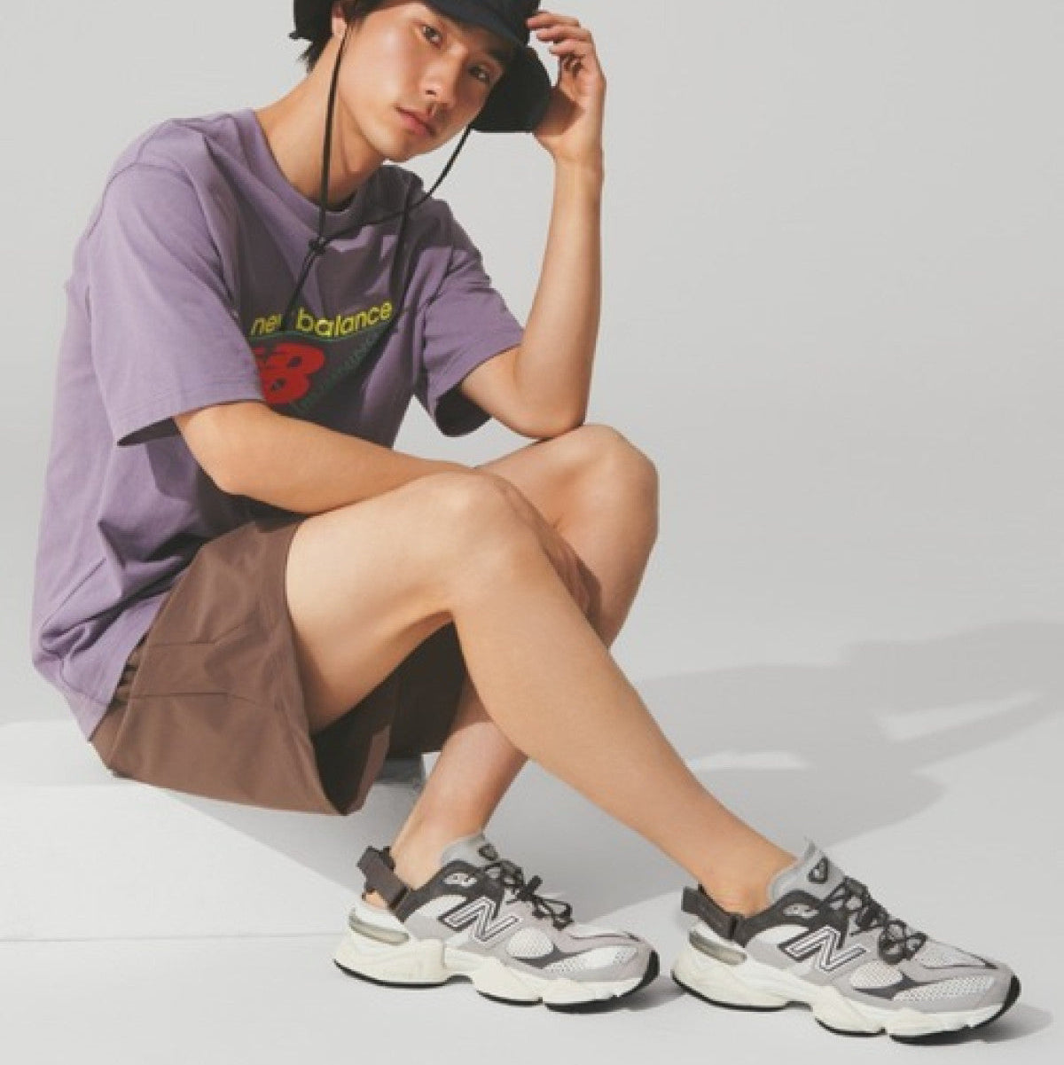New Balance 9060 Mule Raincloud Castlerock sneakers with grey and blue colorway, showcasing the stylish and comfortable design.