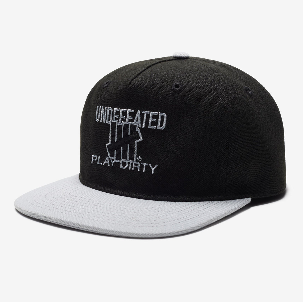 Black Undefeated Play Dirty snapback hat featuring bold branding and adjustable strap, styled as casual headwear.
