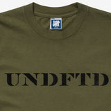 Olive green Undefeated Stencil Logo T-shirt with front graphic, casual short sleeve apparel by UNDEFEATED, shown on a flat surface.