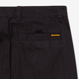 Black Undefeated Utility Pants shown from the side, featuring multiple pockets and a relaxed fit for casual wear.