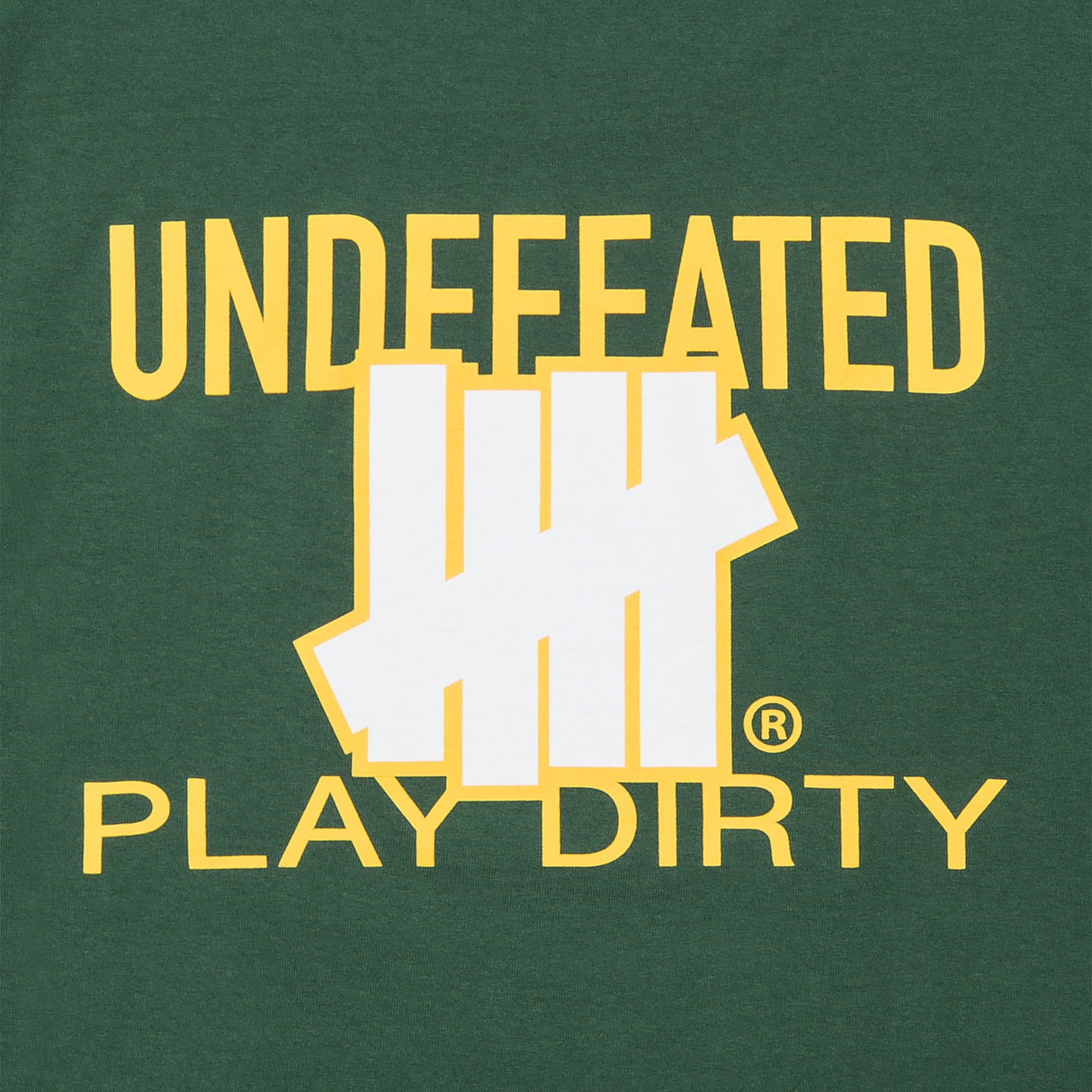 Forest green Undefeated Trademark Tee displayed on a model, featuring the iconic logo on the front.