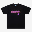 Black Undefeated Wrap Tee shirt featuring a relaxed fit, displayed on a hanger with a plain background.