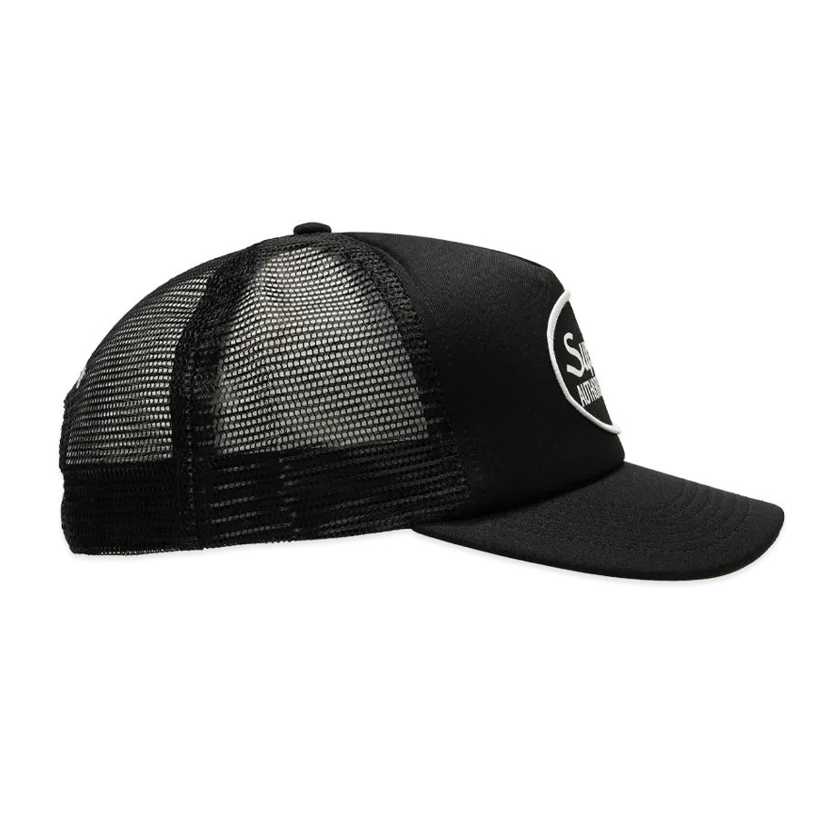 Black Supreme mesh trucker cap, a stylish headwear piece with mesh panels and adjustable snapback closure.