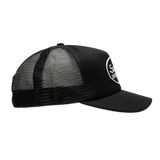 Black Supreme mesh trucker cap, a stylish headwear piece with mesh panels and adjustable snapback closure.