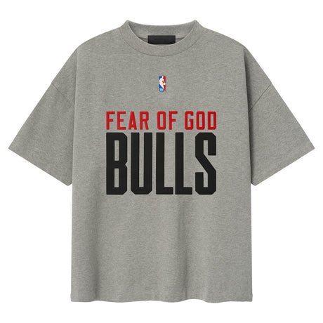 Fear of God Essentials x Chicago Bulls NBA 90s Heavyweight Tee in concrete, unisex apparel with vintage basketball team design.