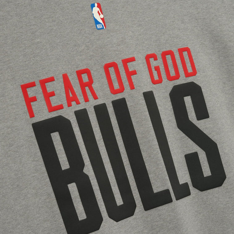 Fear of God Essentials x Chicago Bulls NBA 90s Heavyweight Tee in concrete, unisex apparel with team logo and vintage 90s fit.