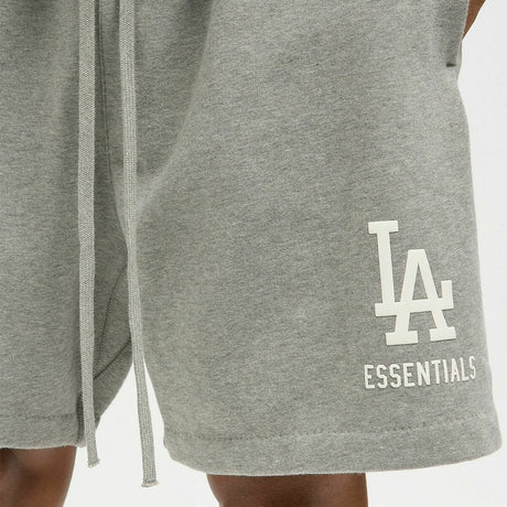 Fear of God Essentials X LA Dodgers sweat shorts in concrete heather, casual athletic apparel with logo details and comfortable fit.