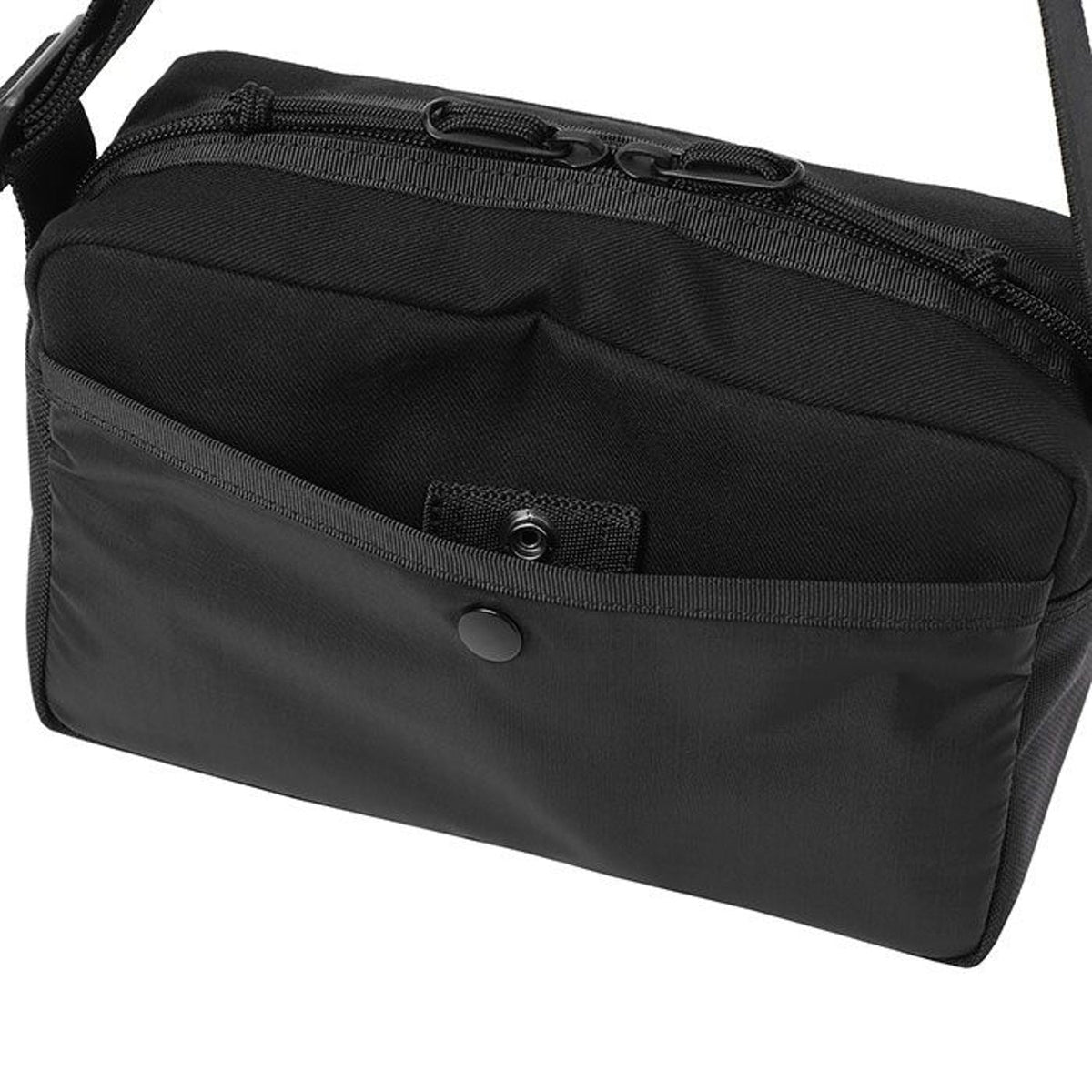 Porter Yoshida Japan Switch Shoulder Bag in black with adjustable strap and front zipper pocket, crafted from durable fabric.