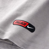 England Nike x Palace premium T-shirt in pewter grey, featuring Nike and Palace branding on soft cotton fabric.