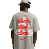 Nike Palace x England T-shirt in Pewter Grey, featuring England and Nike branding, displayed on a flat surface.