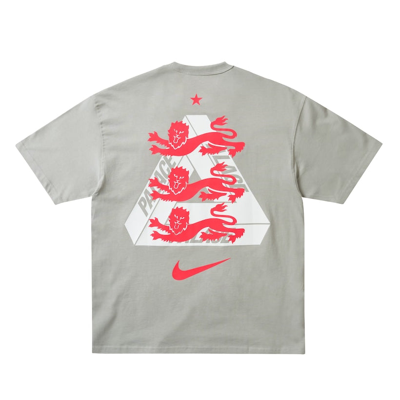 England Nike x Palace premium T-shirt in pewter grey, featuring Nike and Palace branding and a stylish casual fit.