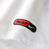 White Nike Palace x England T-shirt featuring England branding and a relaxed fit, displayed on a flat surface.