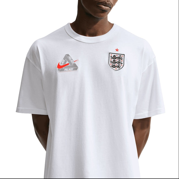 White Palace x Nike England T-shirt with graphic design, featuring Nike logo and England-themed artwork on soft cotton fabric