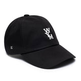 Black Wooyoungmi WYM logo cap, stylish headwear with adjustable strap and embroidered brand logo on the front.