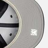 Fear of God Essentials NBA New Era 9FIFTY cap, front view with adjustable strap, black and red design, sports headwear.