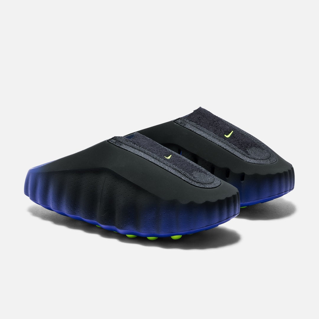Nike Mind 001 Flyknit slide shoes in hyper royal, volt, and black with a sleek, lightweight design and breathable Flyknit material.