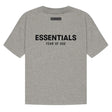 Fear of God Essentials Felt Logo Tee in dark oatmeal, showing the front view with logo detail on soft cotton fabric.