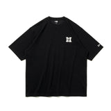 Black oversized T-shirt by MASTERMIND JAPAN and New Era with bold front logo, casual streetwear style, and comfortable fit.