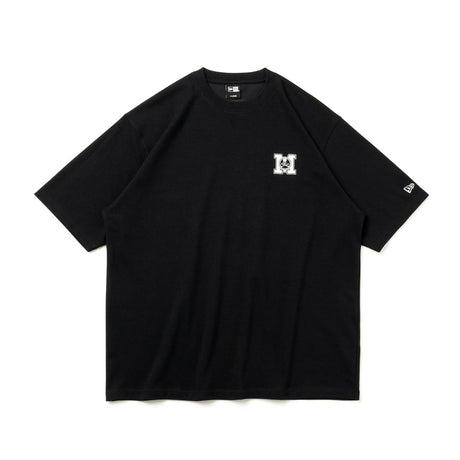 Black oversized T-shirt by MASTERMIND JAPAN and New Era with bold front logo, casual streetwear style, and comfortable fit.