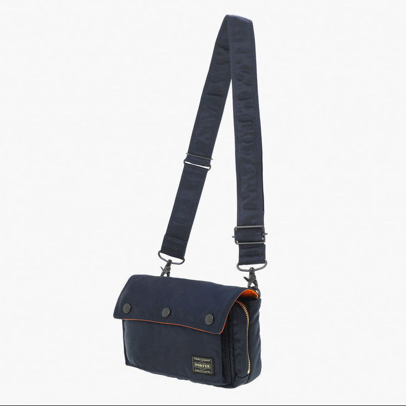 Navy Porter Yoshida Japan Tanker Envelope Bag with leather strap and minimalist design, front flap with secure closure.