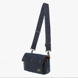 Navy Porter Yoshida Japan Tanker Envelope Bag with leather strap and minimalist design, front flap with secure closure.