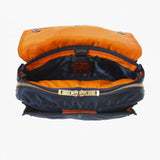 Porter Yoshida Japan Tanker Envelope Bag in navy, a stylish and functional bag with a sleek design and durable material.