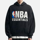 Black Fear of God Essentials NBA hoodie, casual apparel with sporty design and logo, displayed on a flat surface.