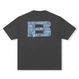 Black Boneless faux denim applique logo tee shirt with short sleeves, casual apparel featuring a stylish denim logo design.