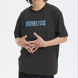 Black boneless faux denim applique logo tee shirt, casual apparel with stylish denim accents and bold logo design.