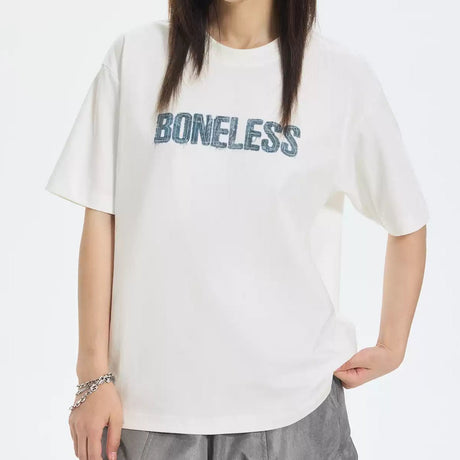 Boneless white faux denim applique logo t-shirt, casual apparel with denim-inspired details and brand logo on front.