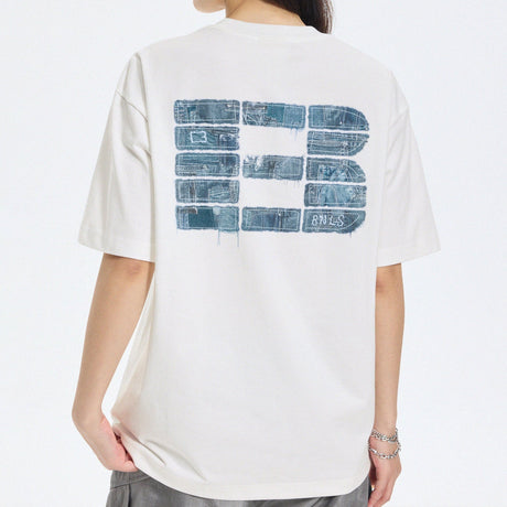 Boneless white faux denim logo applique T-shirt, casual apparel with stylish denim detail and brand logo on front.