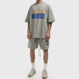 Fear of God Essentials NBA logo sweat shorts in concrete heather, featuring a relaxed fit and sports-inspired design.