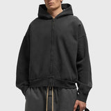 Fear Of God Essentials logo zip-up hoodie in vintage black, featuring a classic design and front logo on soft apparel fabric.